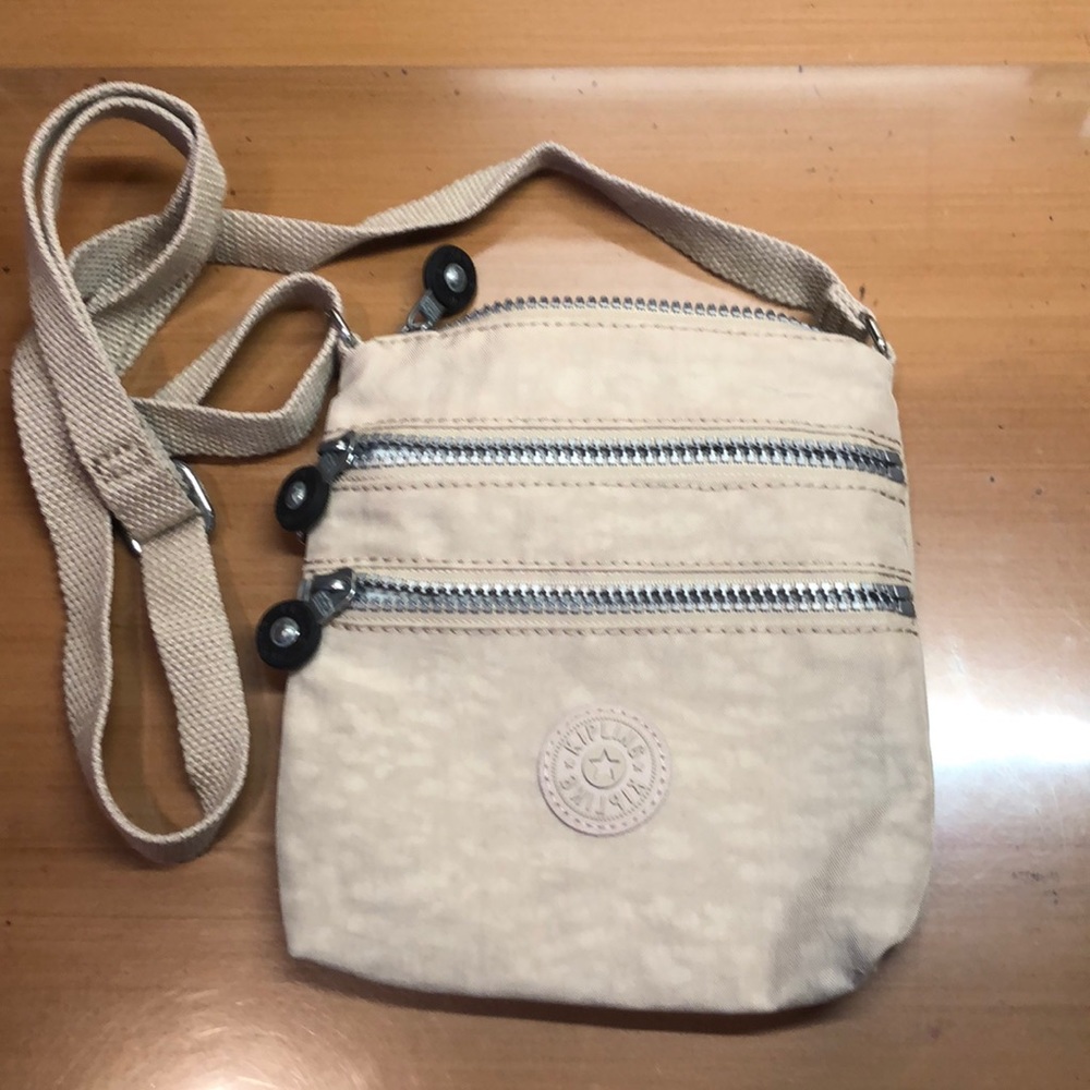 Kipling light tan crossbody bag